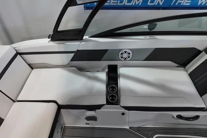 Slide: The Image of 2024 Monterey M-225 boat interior with sleek white seating and modern design elements. - 16