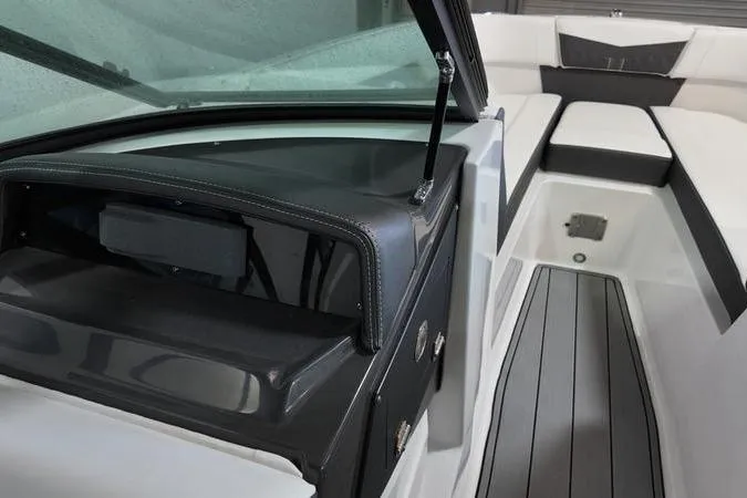 Slide: The Image of 2024 Monterey M-225 boat interior with sleek seating and modern dashboard design. - 17
