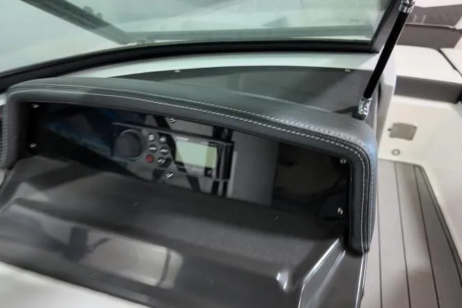 Slide: The Image of 2024 Monterey M-225 boat dashboard with control panel and sleek design. - 18