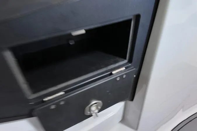 Slide: The Image of 2024 Monterey M-225 storage compartment with lock, featuring a sleek black design. - 19