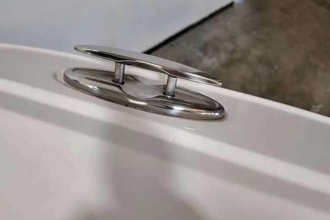 Slide: The Image of 2024 Monterey M-225 boat cleat on white surface, close-up view. - 22