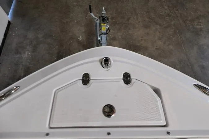 Slide: The Image of 2024 Monterey M-225 boat bow with trailer attachment, viewed from above. - 24