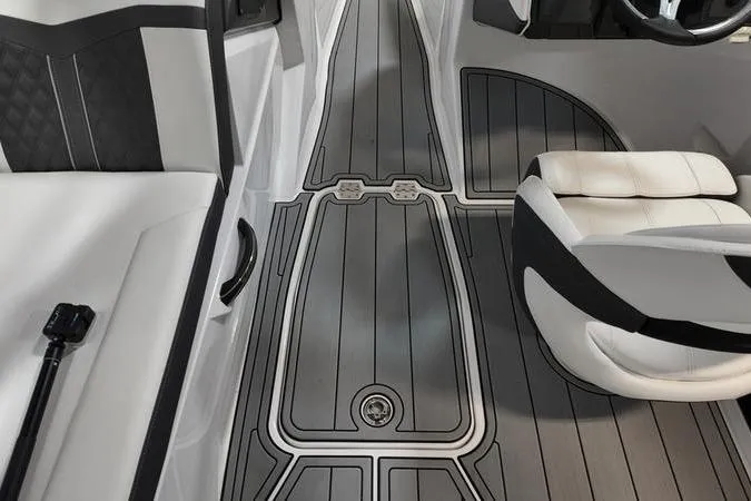 Slide: The Image of 2024 Monterey M-225 boat interior with sleek seating and modern flooring design. - 28