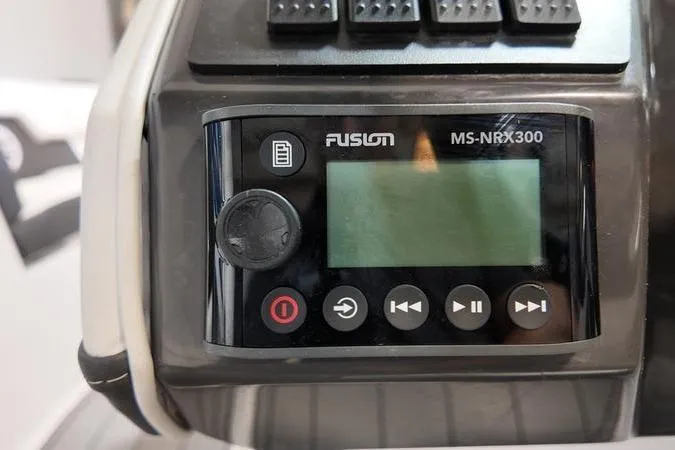 Slide: The Image of Fusion MS-NRX300 audio system on 2024 Monterey M-225 boat dashboard. - 34