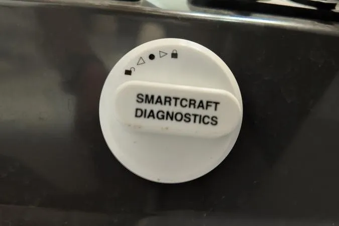 Slide: The Image of SmartCraft Diagnostics button on 2024 Monterey M-225 boat dashboard. - 35