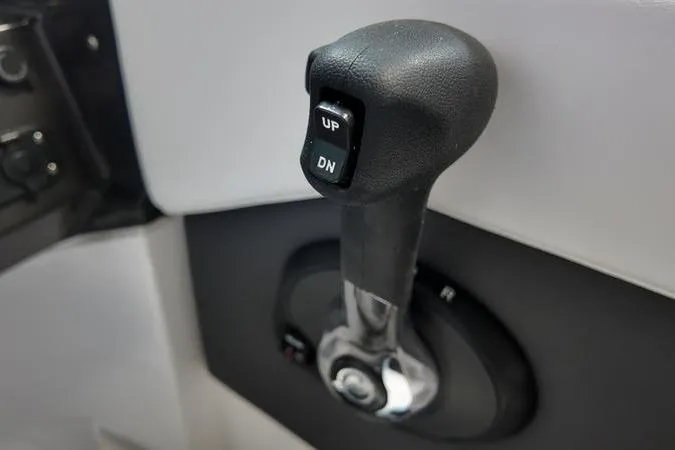 Slide: The Image of 2024 Monterey M-225 boat throttle control lever with "UP" and "DN" buttons. - 37
