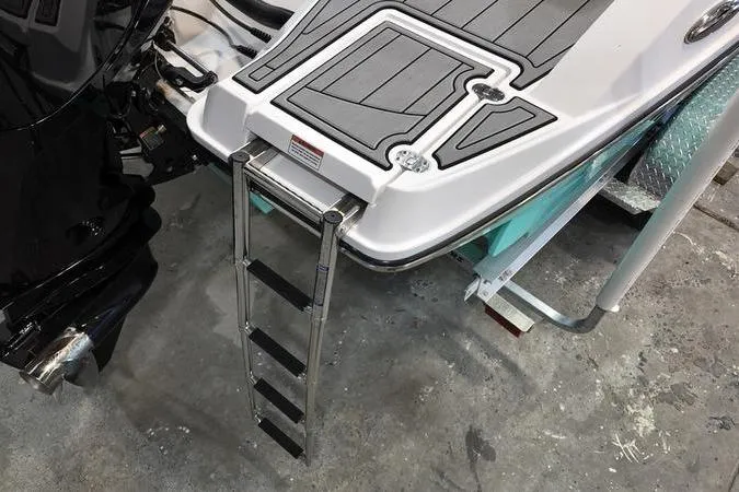 Slide: The Image of 2024 Monterey M-225 boat with extended swim platform and retractable ladder. - 5