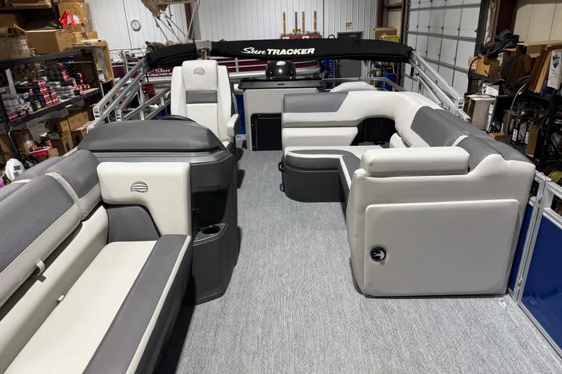 Slide: The Image of 2026 Sun Tracker Fishin' Barge 20 DLX interior with spacious seating and modern design. - 5