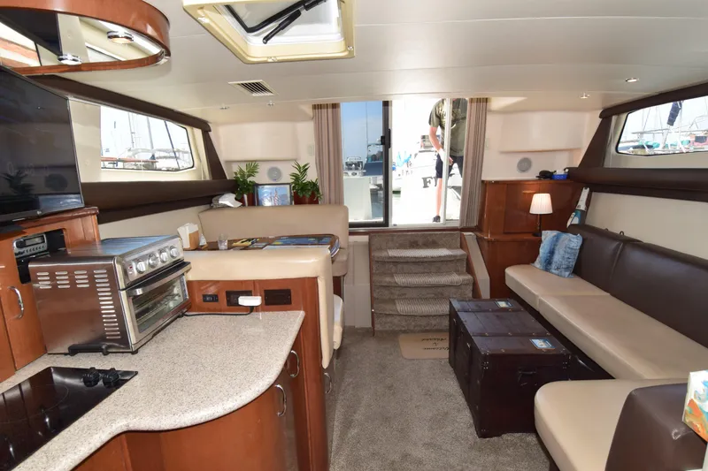 Slide: The Image of Luxurious interior of 2008 Carver 36 Mariner yacht with modern amenities and cozy seating. - 1