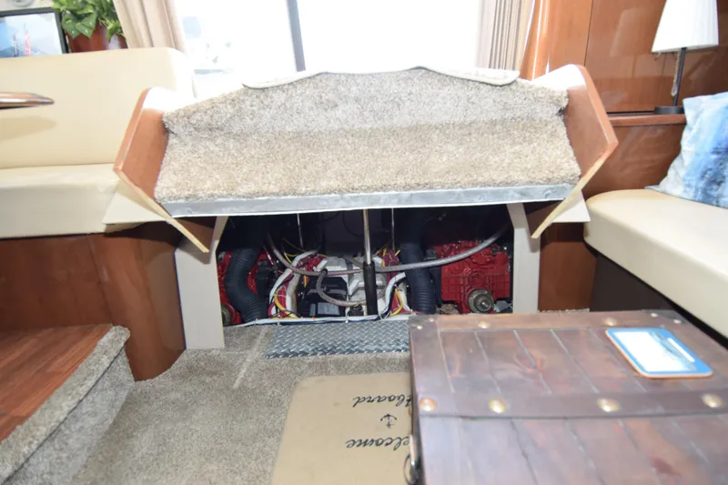 Slide: The Image of Interior view of a 2008 Carver 36 Mariner engine compartment with carpeted access. - 10