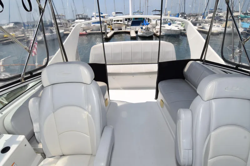 Slide: The Image of 2008 Carver 36 Mariner yacht interior with white seating, docked at marina. - 20