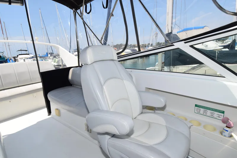 Slide: The Image of 2008 Carver 36 Mariner interior with white seating, docked at marina. - 22
