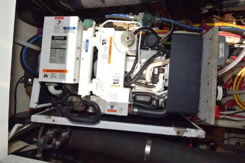 Slide: The Image of Engine compartment of a 2008 Carver 36 Mariner with Kohler generator and wiring. - 26