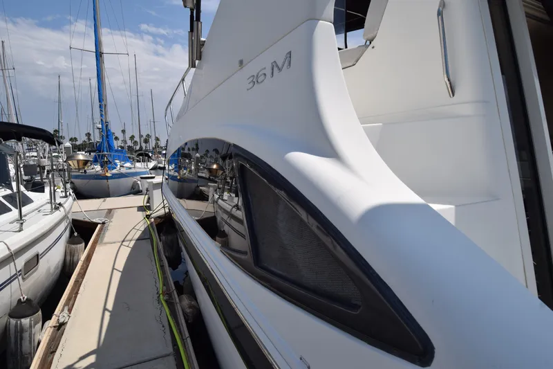 Slide: The Image of 2008 Carver 36 Mariner yacht docked at marina, side view with reflections. - 28