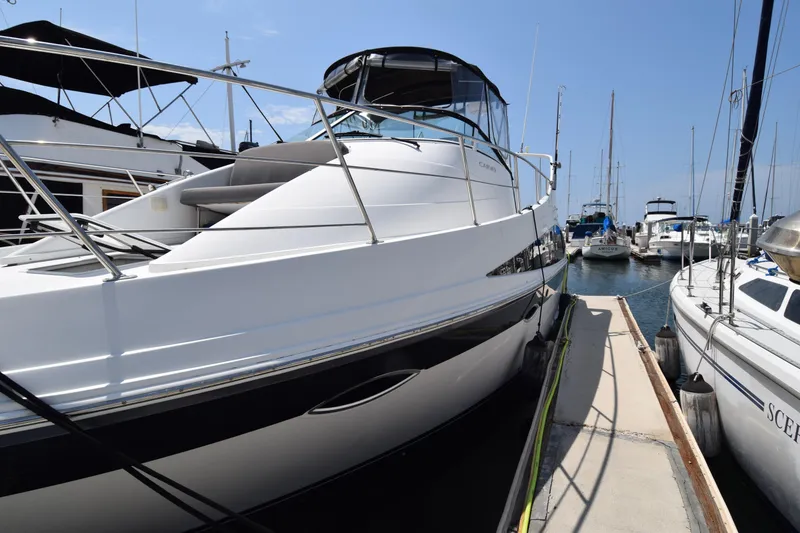Slide: The Image of 2008 Carver 36 Mariner yacht docked at marina under clear blue sky. - 29