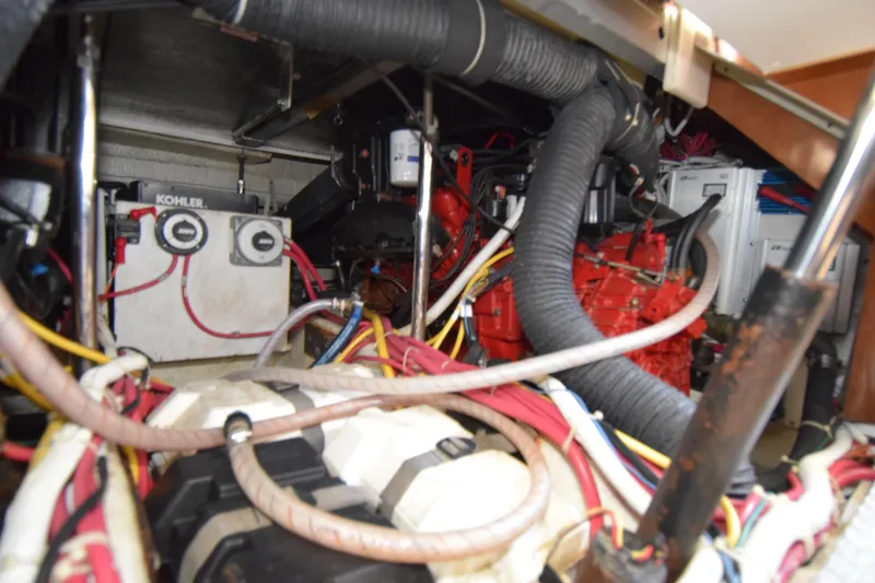 Slide: The Image of Engine room of 2008 Carver 36 Mariner with visible wiring and components. - 12