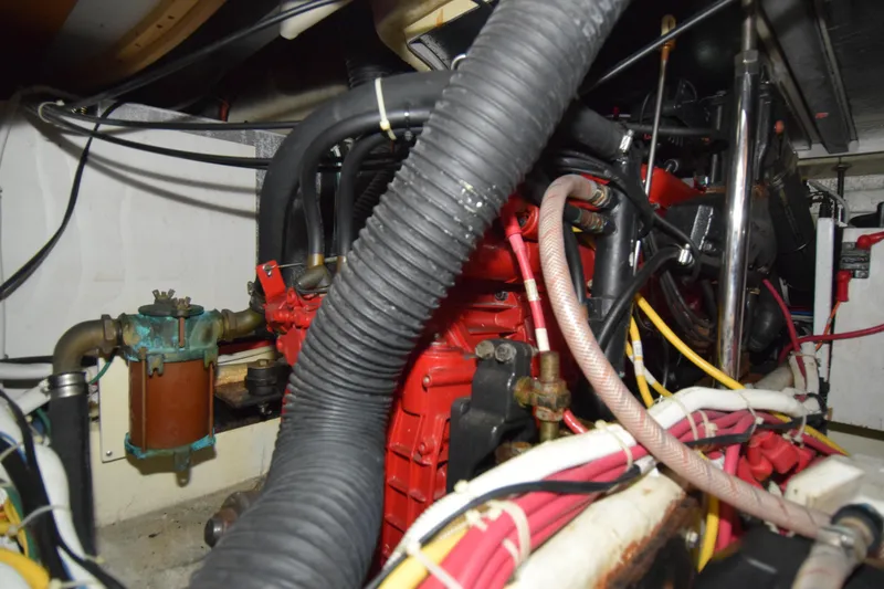 Slide: The Image of Engine compartment of 2008 Carver 36 Mariner with visible hoses and wiring. - 15