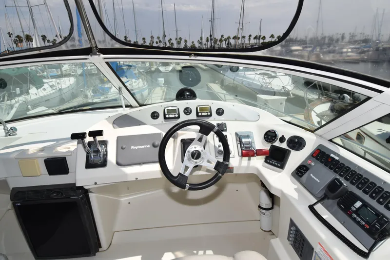 Slide: The Image of Helm of 2008 Carver 36 Mariner yacht with steering wheel and navigation controls. - 18