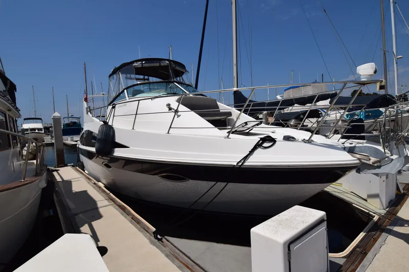 Slide: The Image of 2008 Carver 36 Mariner yacht docked at marina under clear blue sky. - 30