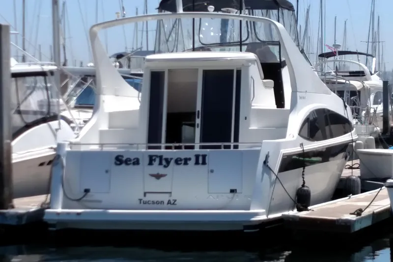 Slide: The Image of 2008 Carver 36 Mariner yacht docked, named "Sea Flyer II," in a marina setting. - 33