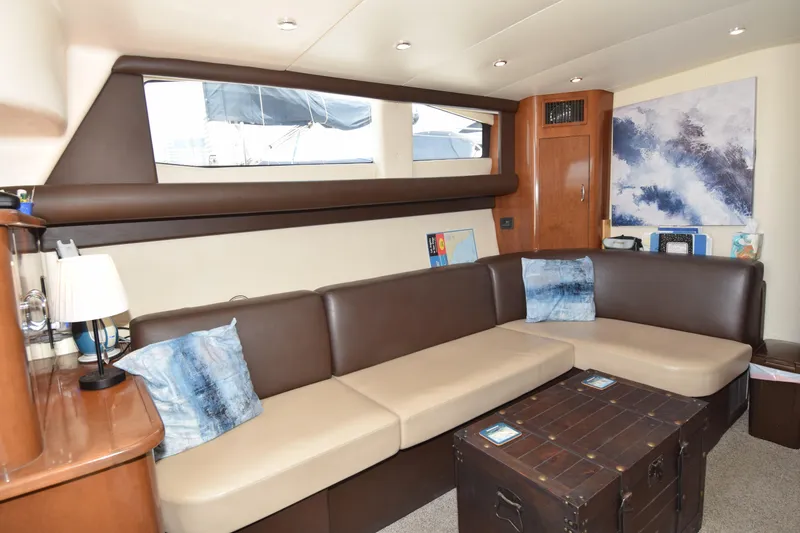 Slide: The Image of Interior of 2008 Carver 36 Mariner yacht with cozy seating and nautical decor. - 4