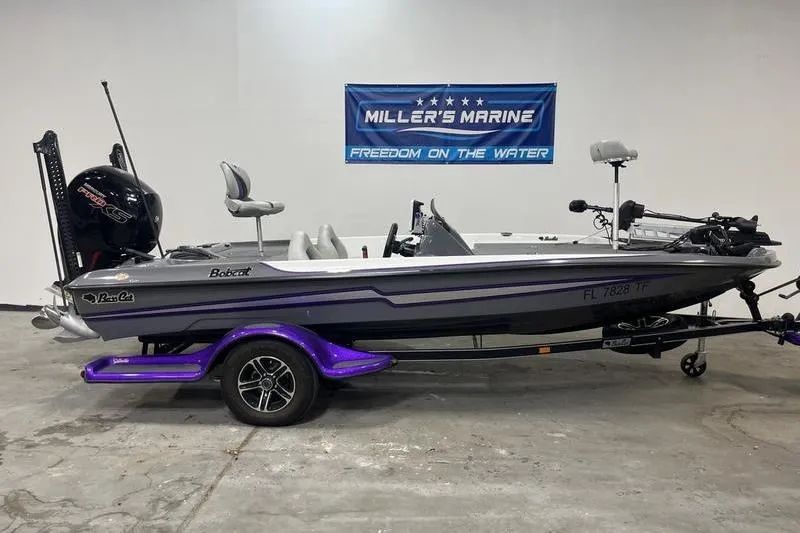 Slide: The Image of 2022 Bass Cat Bobcat boat on trailer at Miller's Marine showroom. - 0