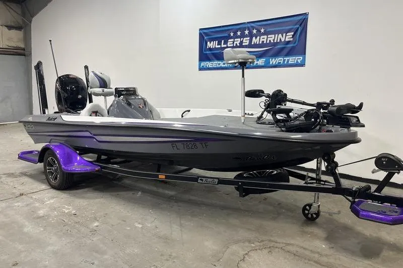 Slide: The Image of 2022 Bass Cat Bobcat boat on trailer at Miller's Marine showroom. - 1