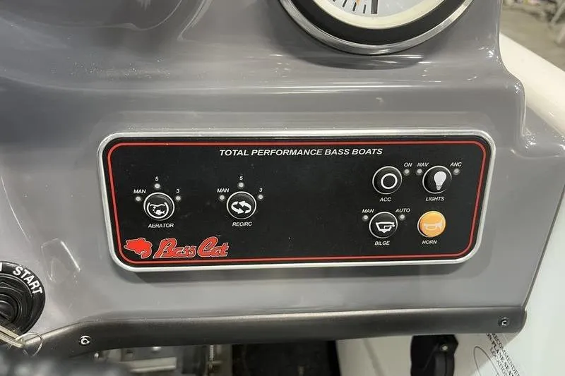 Slide: The Image of Control panel of 2022 Bass Cat Bobcat boat with various switches and dials. - 10