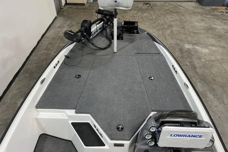 Slide: The Image of 2022 Bass Cat Bobcat boat deck with Lowrance electronics and trolling motor. - 12