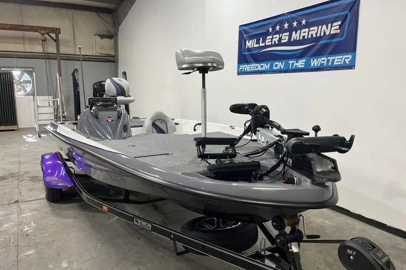 Slide: The Image of 2022 Bass Cat Bobcat boat in showroom, featuring sleek design and advanced equipment. - 2
