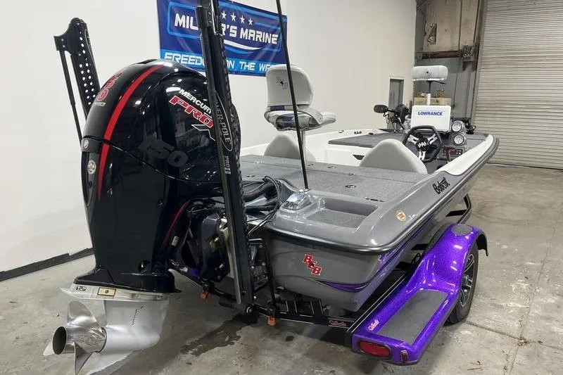 Slide: The Image of 2022 Bass Cat Bobcat boat with Mercury Pro XS engine in a showroom. - 3