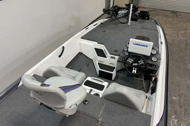 Slide: The Image of 2022 Bass Cat Bobcat boat interior with Lowrance electronics and dual seating. - 5