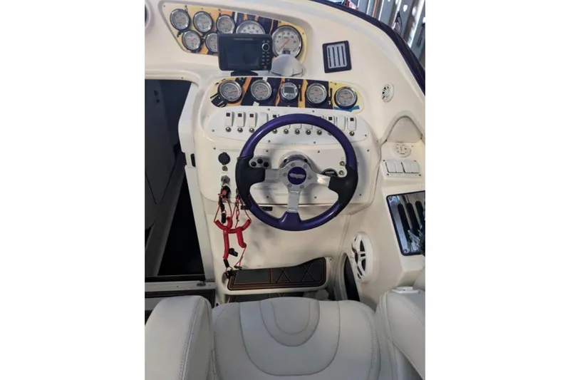 Slide: The Image of 2007 Sunsation 32 Dominator boat dashboard with gauges and steering wheel. - 4
