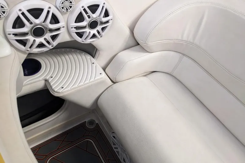 Slide: The Image of 2007 Sunsation 32 Dominator interior with white leather seats and audio speakers. - 7