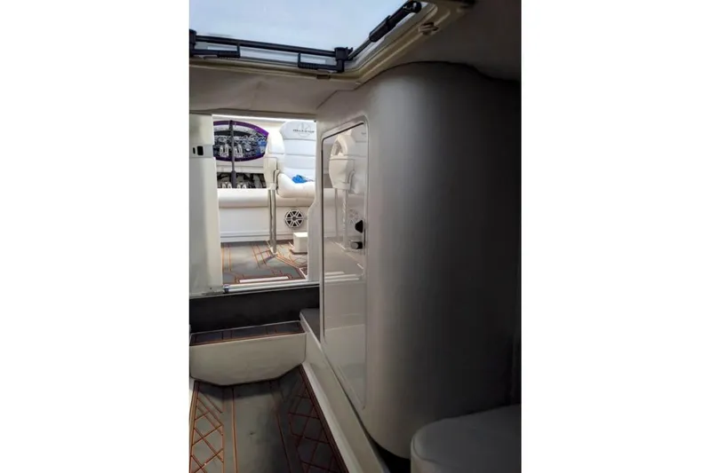 Slide: The Image of Interior view of 2007 Sunsation 32 Dominator boat, featuring cockpit and seating area. - 9