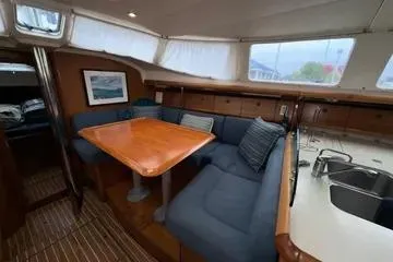 Slide: The Image of Interior of 2002 Jeanneau Sun Odyssey 43 DS with dining area and kitchenette. - 10