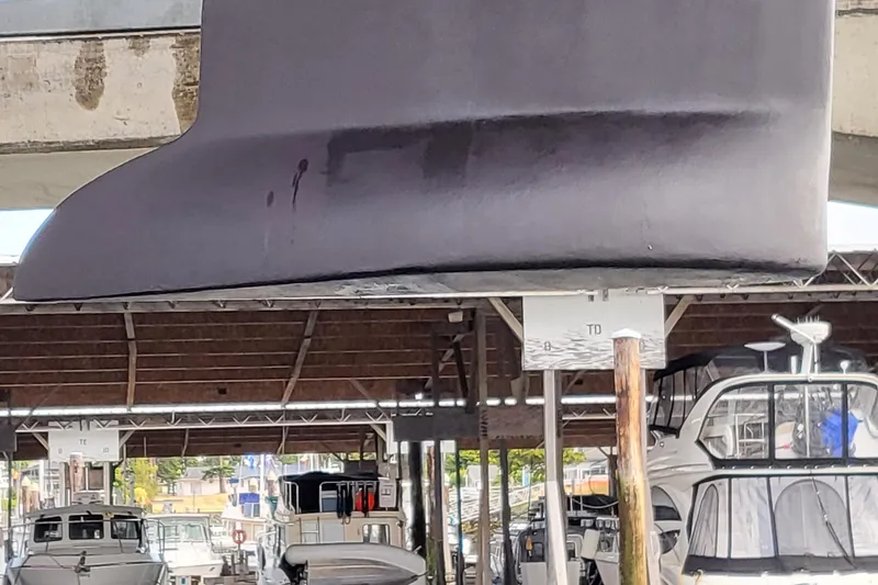 Slide: The Image of Jeanneau Sun Odyssey 43 DS sailboat hull in a marina, 2002 model. - 15