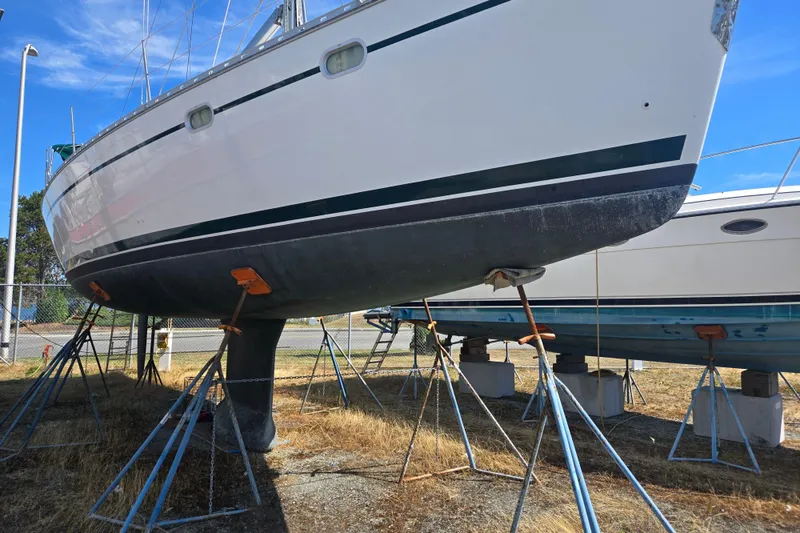 Slide: The Image of 2002 Jeanneau Sun Odyssey 43 DS sailboat on stands, dry docked for maintenance. - 4