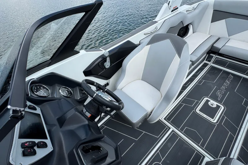 Slide: The Image of 2021 Supreme ZS232 boat interior with modern dashboard and seating. - 15