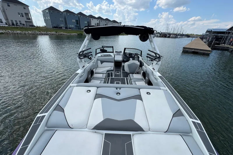 Slide: The Image of 2021 Supreme ZS232 boat interior on calm water, featuring sleek seating and modern design. - 29
