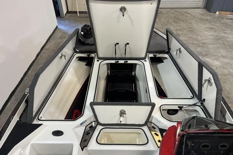 Slide: The Image of 2022 Ranger Z520R boat storage compartments open, showcasing spacious interior design. - 17
