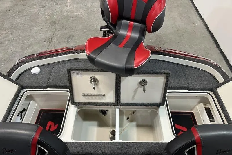 Slide: The Image of 2022 Ranger Z520R boat interior with red and black seating and storage compartments. - 6