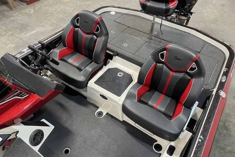 Slide: The Image of 2022 Ranger Z520R boat interior with black and red seats, steering console, and storage compartments. - 7