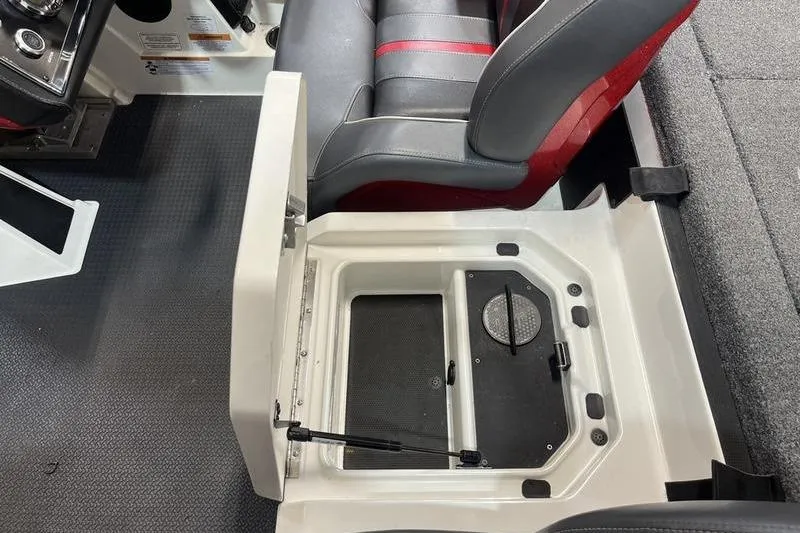 Slide: The Image of 2022 Ranger Z520R boat interior with open storage compartment and seating. - 8