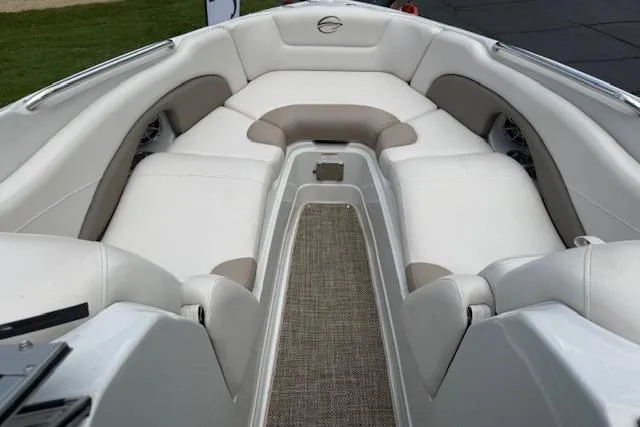 Slide: The Image of 2018 Crownline 255 SS boat interior with white and beige seating. - 12