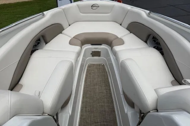 Slide: The Image of 2018 Crownline 255 SS boat interior with white and beige seating. - 13
