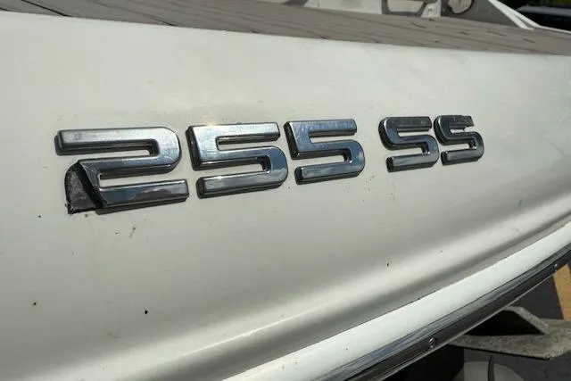 Slide: The Image of 2018 Crownline 255 SS boat emblem on white surface. - 36
