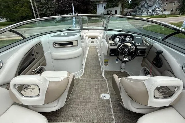 Slide: The Image of 2018 Crownline 255 SS boat interior with modern dashboard and seating. - 5