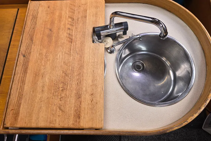 Slide: The Image of Stainless steel sink with wooden cover in 1991 Beneteau 35.5 S5 yacht kitchen. - 10