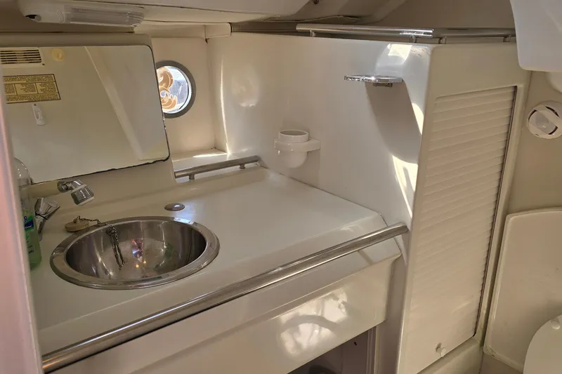 Slide: The Image of Bathroom interior of 1991 Beneteau 35.5 S5 yacht with sink and mirror. - 14